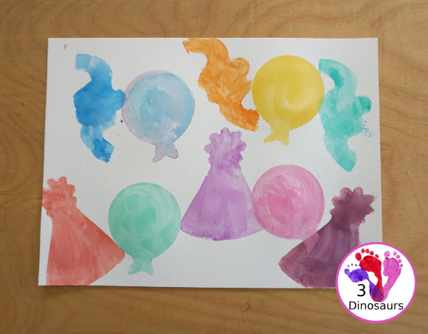 Party Watercolor Painting with Cookie Cutters - a simple cookie cutter painting with party themed cookie cutters that is great for a party and also New years - 3Dinosaurs.com