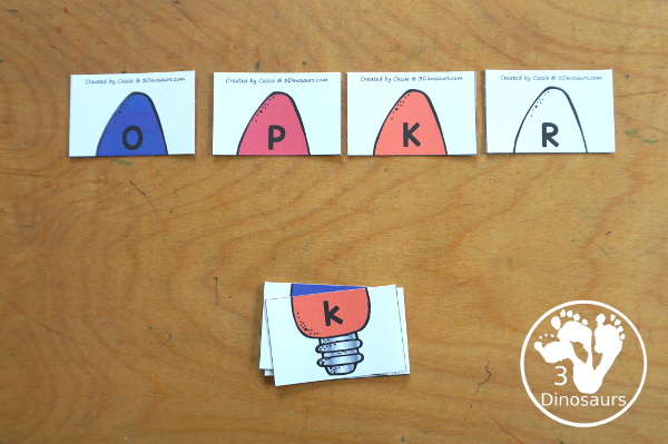 Free Christmas Lights ABC Matching Printable - a fun letter matching printable for kids with different colored Christmas lights. You match uppercase letters and lowercase letters- 3Dinosaurs.com