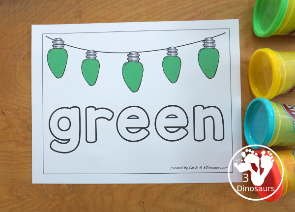 Free Christmas Color Word Playdough Mat Printables - a strip of Christmas lights in a single color with color word below. A fun Christmas theme for color word playdough mat for kids.- 3Dinosaurs.com