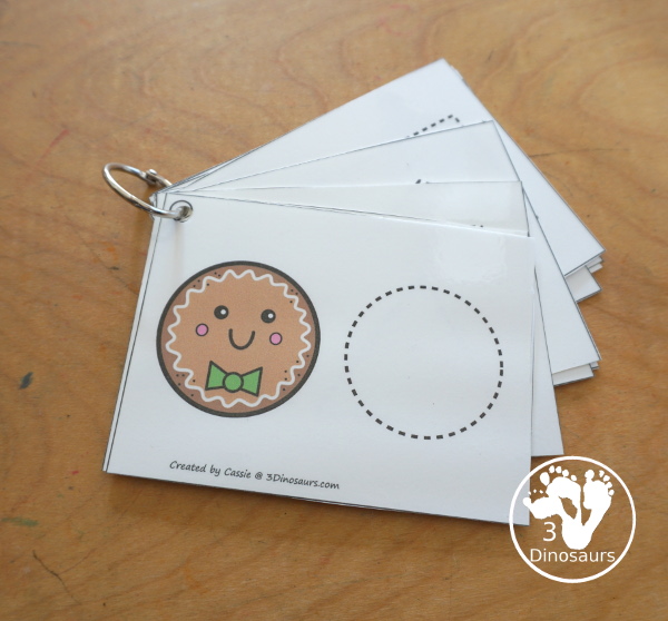 Free Gingerbread Shape Tracing Card Printable - has 12 shapes for kids to trace. You have a picture of the gingerbread man face with the shape, and then a shape to trace. 3Dinosaurs.com