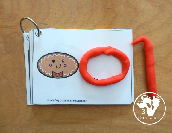 Free Gingerbread Shape Tracing Card Printable - has 12 shapes for kids to trace. You have a picture of the gingerbread man face with the shape, and then a shape to trace. 3Dinosaurs.com