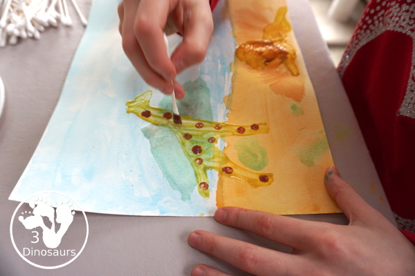 Giraffe & Lion Painting with Lions at Lunchtime - a fun watercolor and cookie cutter painting activity to make an African animal scene - 3Dinosaurs.com