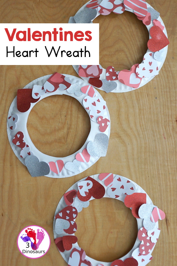 Valentines Heart Wreaths with Scrapbook Paper a fun paper plate wreath made using a heart punch and loads of fun for Valentines Day - 3Dinosaurs.com
