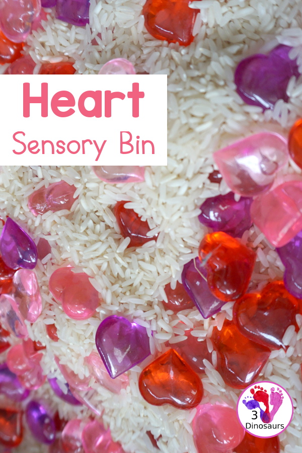Heart Rice Sensory Bin For Kids - acrylic hearts in a rice sensory bin that you can use with kids during Valentines or a heart shape theme. - 3Dinosaurs.com