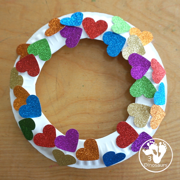 Rainbow Heart Wreath - made with glitter hearts and a paper plate that is super simple to put together for heart theme of Valentines - 3Dinosaurs.com