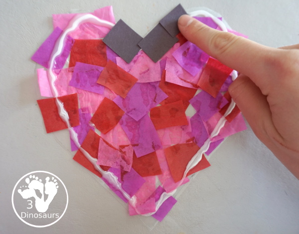 Stained Glass Hearts Craft For Valentine's Day - a simple wax paper craft for kids with tissue paper glue and tissue paper. - 3Dinosaurs.com