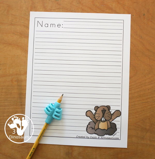 Free Groundhog Writing Paper Printables - You have two picture options for the groundhog. You have a groundhog standing and a groundhog coming out the ground. There are a single line option and a guideline option. Perfect for groundhog day writing. 3Dinosaurs.com