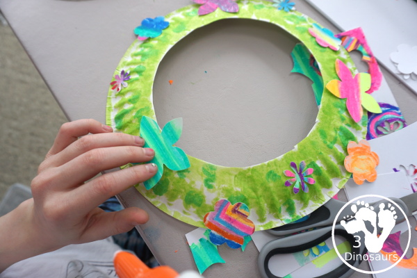 Flower Themed Paper Plate Wreath: Oil Pastels - fun and easy wreaths to make at any time using flower punches and paper plates - 3Dinosaurs.com