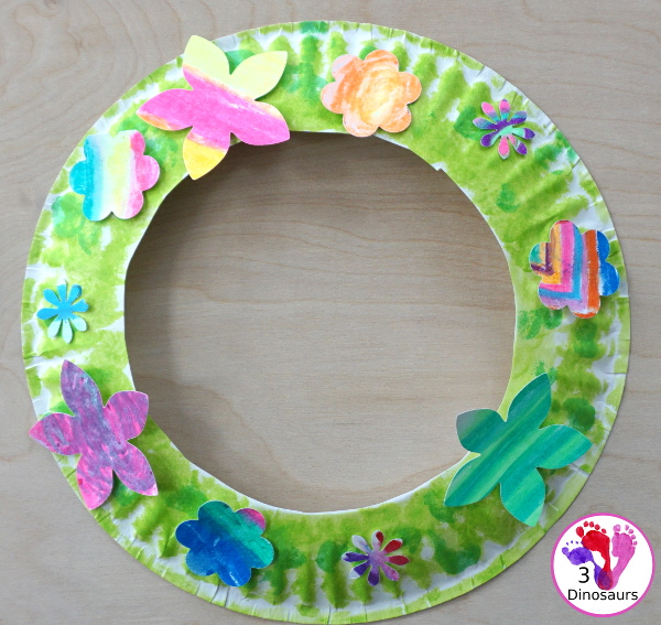Flower Themed Paper Plate Wreath: Oil Pastels - fun and easy wreaths to make at any time using flower punches and paper plates - 3Dinosaurs.com