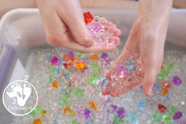 Rainbow Colors Water Bead Sensory Bin - a great sensory bin exploring colors through clear waterbeads a fun sensory play for kids to do. - 3Dinosaurs.com