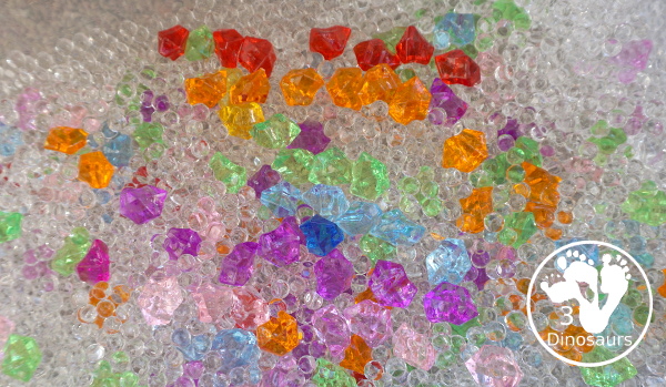 Rainbow Colors Water Bead Sensory Bin - a great sensory bin exploring colors through clear water beads a fun sensory play for kids to do. - 3Dinosaurs.com
