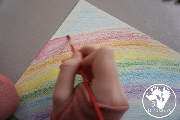 Rainbow Watercolor Pencil Painting - this is a great way to change up coloring and painting activities and watch how the pencil coloring mixes on the paper and makes a great watercolor painting  - 3Dinosaurs.com