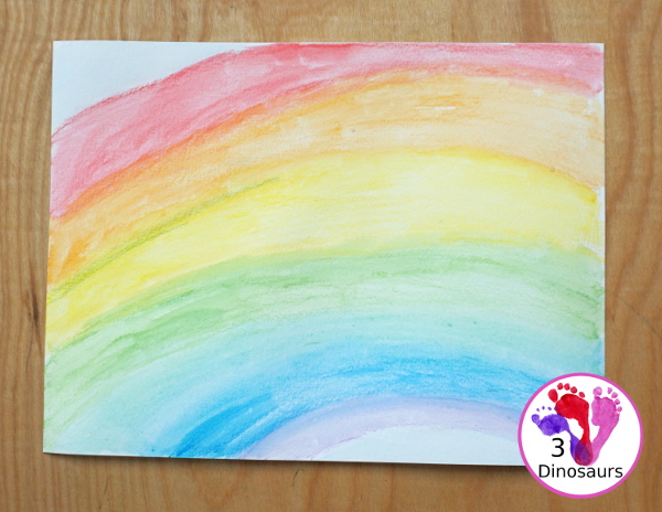 Rainbow Watercolor Pencil Painting - this is a great way to change up coloring and painting activities and watch how the pencil coloring mixes on the paper and makes a great watercolor painting  - 3Dinosaurs.com