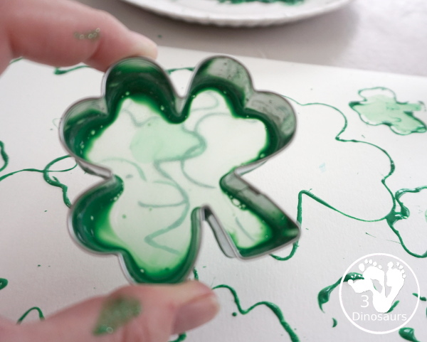 Clover Stamping Painting For Kids - a fun cookie cutter painting for kids with clover cookie cutters a fun St. Patrick's Day activities for kids - 3Dinosaurs.com