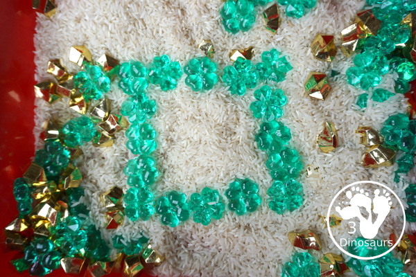 Clover & Gold Rice Sensory Bin for Saint Patrick's Day - a simple sensory bin for Saint Patrick's day that you can use with kids. - 3Dinosaurs.com