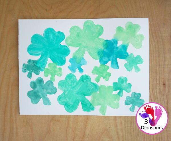 Clover Watercolor Painting for kids - You use watercolor paints, watercolor paper, and clover cookie cutters to make a fun Saint Patrick's Day watercolor painting - 3Dinosaurs.com