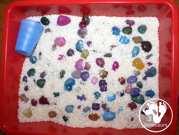 Rock & Rice Sensory Bin - a simple rock and rice sensory bin you can use with kids. Just add cups and scoops rice and rocks for fun sensory play - 3Dinosaurs.com