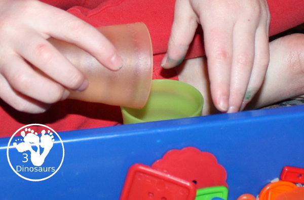 Shape Button Sensory Bin - a simple sensory bin made with rice base and different sizes of shape buttons. An easy shape sensory bin for prek and kindergarten. - 3Dinosaurs.com