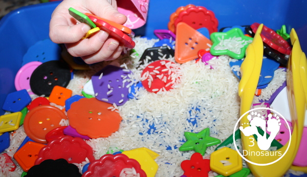 Shape Button Sensory Bin - a simple sensory bin made with rice base and different sizes of shape buttons. An easy shape sensory bin for prek and kindergarten. - 3Dinosaurs.com