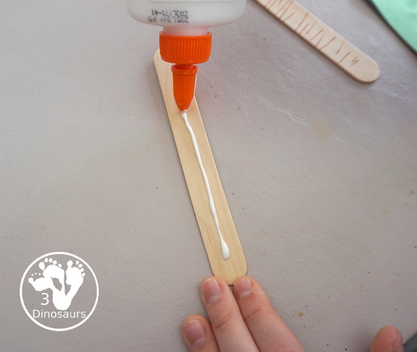 Washi Tape Truffula Tree Craft - a fun Lorax craft for kids to make with a little fun with fine motor truffula craft that kids can make. It is made with paper, washi tape and craft sticks. - 3Dinosaurs.com