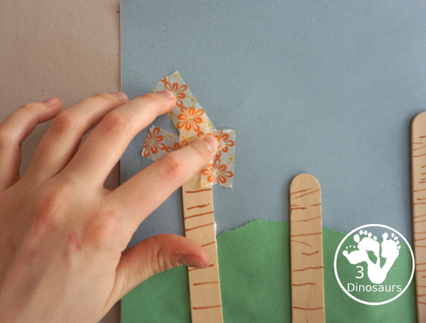 Washi Tape Truffula Tree Craft - a fun Lorax craft for kids to make with a little fun with fine motor truffula craft that kids can make. It is made with paper, washi tape and craft sticks. - 3Dinosaurs.com