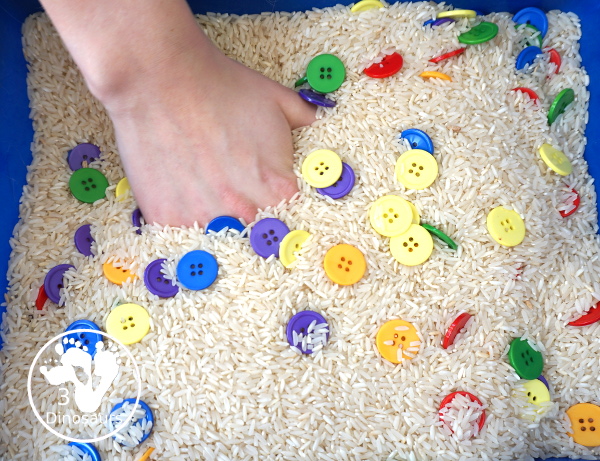 Rainbow Button Sensory Bin - a simple button sensory bin with a rice filler. You have buttons in the colors of the rainbow mixed in with the rice in the sensory bin. A simple and easy sensory bin to set up. - 3Dinosaurs.com