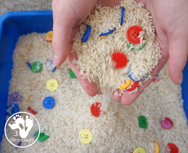 Rainbow Button Sensory Bin - a simple button sensory bin with a rice filler. You have buttons in the colors of the rainbow mixed in with the rice in the sensory bin. A simple and easy sensory bin to set up. - 3Dinosaurs.com