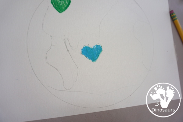 Oil Pastel Earth with Heart Shapes - a great craft that works on blending colors and making a very fun planet Earth for Earth Day - 3Dinosaurs.com