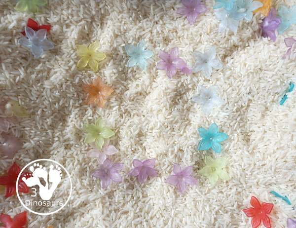 Flower & Rice Sensory Bin - make shapes, letters and numbers with the flowers. - 3Dinosaurs.com