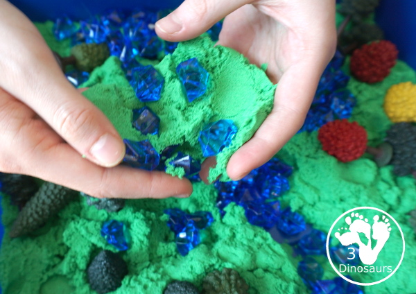 Tree & Kinetic Sand Sensory Bin for Arbor day and Earth Day - playing in the sensory bin and that it is important for kids - 3Dinosaurs.com