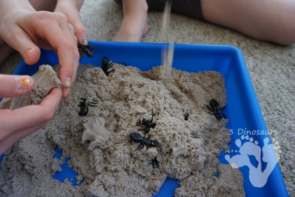 Fun Sensory Play in an Ant & Kinetic Sand Sensory Bin - an easy to set up and play in sensory bin for kids with an ant theme - 3Dinosaurs.com