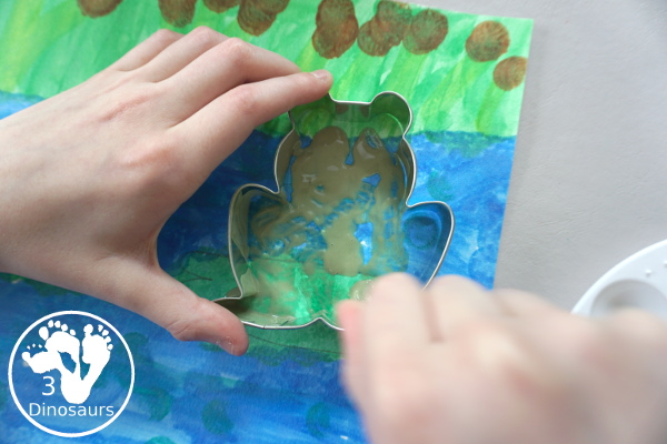 Frog Cookie Cutter Painting - a fun q-tip and dot marker pond painting that is super fun for kids to do - 3Dinosaurs.com
