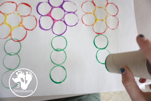 Paper Roll Flower Painting - a simple flower garden craft using paper, paints and paper rolls - making the stem of the flower - 3Dinosaurs.com