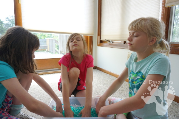 Rock & Water Bead Sensory Bin - a great hands-on play with rocks and sensory bins for kids of all ages - 3Dinosaurs.com #sensorybin #sensoryplay