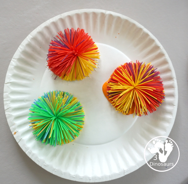 Firework Painting with String Balls - with a simple rubber band string ball painting with different colors and great for the Fourth of July and any Firework themes. And also works for the Opening Ceremony for the Olympics