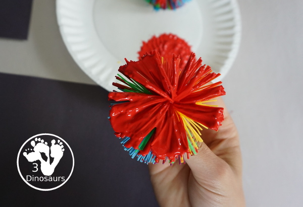 Firework Painting with String Balls - with a simple rubber band string ball painting with different colors and great for the Fourth of July and any Firework themes. And also works for the Opening Ceremony for the Olympics