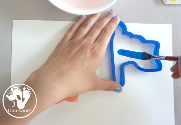 Stars & Flag Watercolor Painting with Cookie Cutters - a simple painting activity that you can do with kids with red and blue colors painting inside stars and flags.- 3Dinosaurs.com