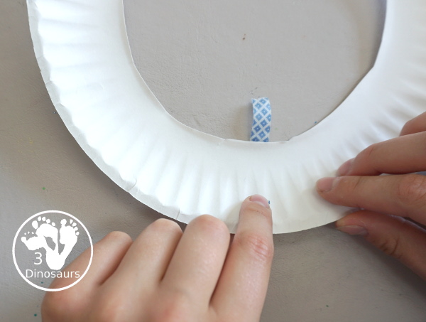 Red, White, and Blue Washi Tape Wreath - a simple paper plate wreath made with washi tape with colors for the Fourth of July. 3Dinosaurs.com