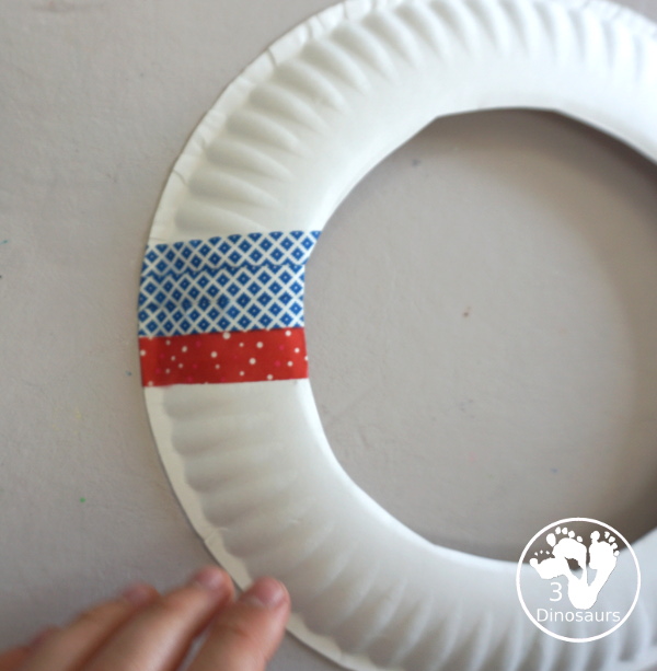 Red, White, and Blue Washi Tape Wreath - a simple paper plate wreath made with washi tape with colors for the Fourth of July. 3Dinosaurs.com