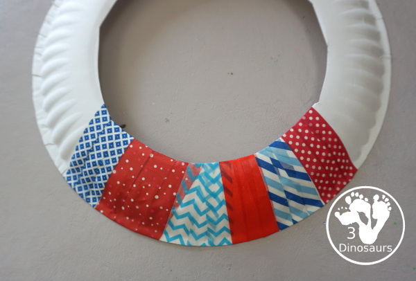 Red, White, and Blue Washi Tape Wreath - a simple paper plate wreath made with washi tape with colors for the Fourth of July. 3Dinosaurs.com