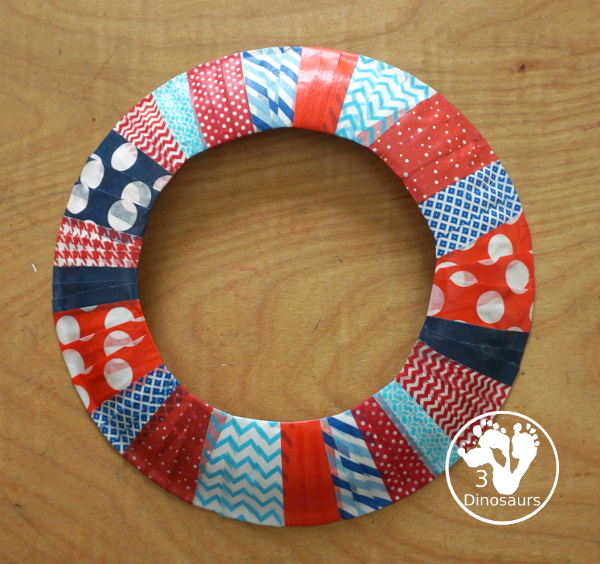 Red, White, and Blue Washi Tape Wreath - a simple paper plate wreath made with washi tape with colors for the Fourth of July. 3Dinosaurs.com