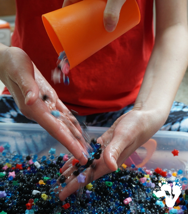 Star Themed Water Bead Sensory Bin - simple to make and play in with loads of space-themed fun for kids  - 3Dinosaurs.com