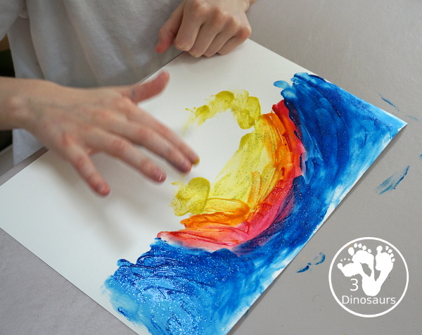 Finger Painting Fireworks with Glitter Paint for kids - easy and fun sensory painting activity that is a great way to make fireworks. - A fun way to use left over paints- 3Dinosaurs.com