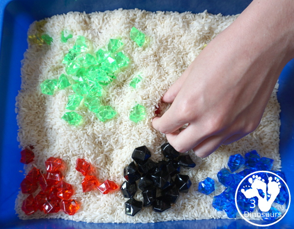 Olympic Flag Colors Sensory Bin - a simple sensory bin to explore the different colors that make the rings on the Olympic Flag - 3Dinosaurs.com