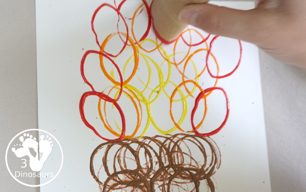 Paper Roll Torch Painting - a simple painting made with paper rolls and paint to make a Torch for the Olympics - 3Dinosaurs.com