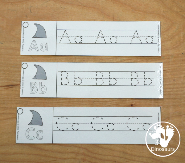Free Shark ABC Tracing Strips - with uppercase and lowercase together. You have fun kids with a shark fin plus you can see an example of how to trace the letters. They have all 26 letters of the alphabet - 3Dinosaurs.com