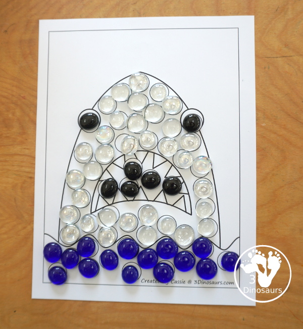 Free Shark Fine Motor Mats - You have 4 fine motor mats to use with kids for shark week. You have a shark template, a shark tracing page, a shark q-tip page, and a shark dot marker page. A great preschool, prek, and kindergarten fine motor work. 3Dinosaurs.com