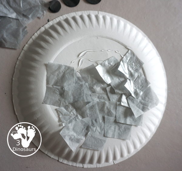 Tissue Paper Moon Paper Plate Craft - a fun tissue paper craft that kids can make for a moon theme. A fun way to make a moon with kids for Moon Day in July or any Moon theme. They will enjoy it. 3Dinosaurs.com