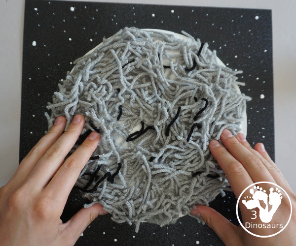 Yarn Moon Craft For Kids is simple to make with a paper plate, glue and yarn to make the moon. It is great for Moon Day or any moon theme you do with kids. - 3Dinosaurs.com