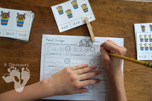 Free Pencil Groups Multiplication Clip Cards - 12 clip cards with matching worksheet - 3Dinosaurs.com #clipcards #freeprintable #multiplication #backtoschool